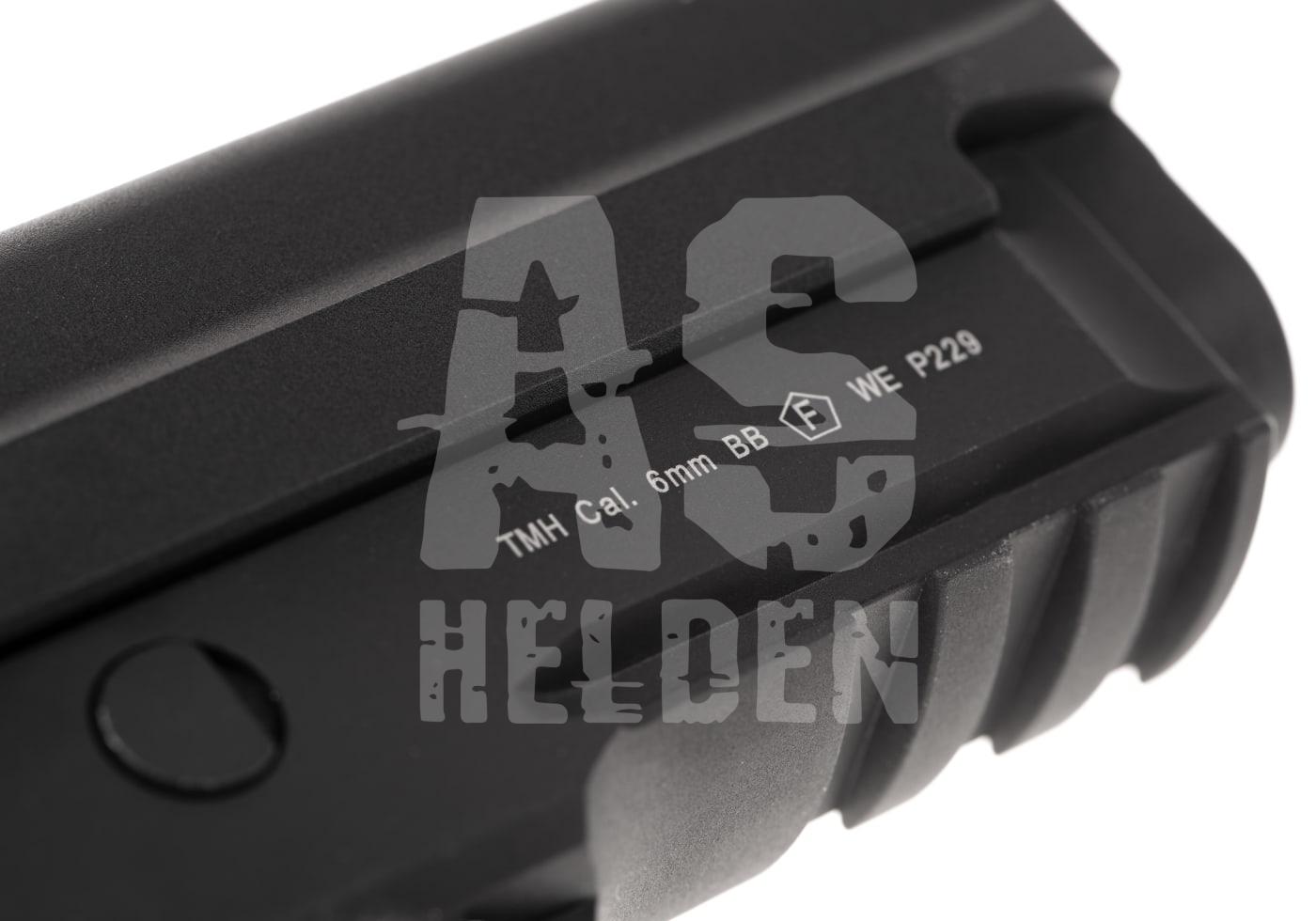Nahaufnahme eines schwarzen Airsoft-Slide mit Markierungen "TMH Cal. 6mm BB" und "WE P229".