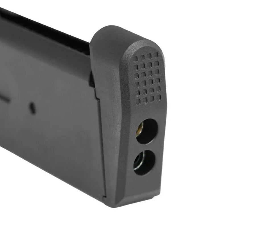 Schwarzes Magazin mit abgerundeter Ecke und zwei Öffnungen an der Unterseite.