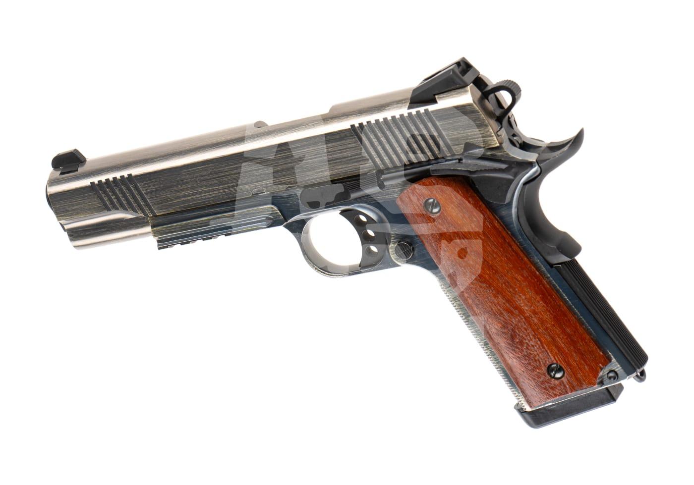 Nuprol Raven MEU Railed GBB Brushed - ab 18 Jahren Airsoft-Pistole mit Metall-Slide und braunem Holzgriff, seitlich abgebildet.