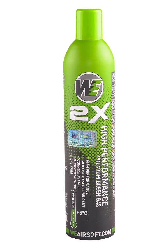 Grüne Gasflasche für Airsoft, "WE 2X High Performance", enthält Silikon, dargestellt mit Etikett.