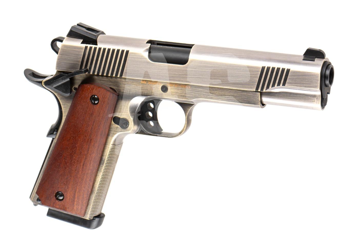 Silberne Airsoft-Pistole 1911 mit Holzgriff, seitliche Ansicht.