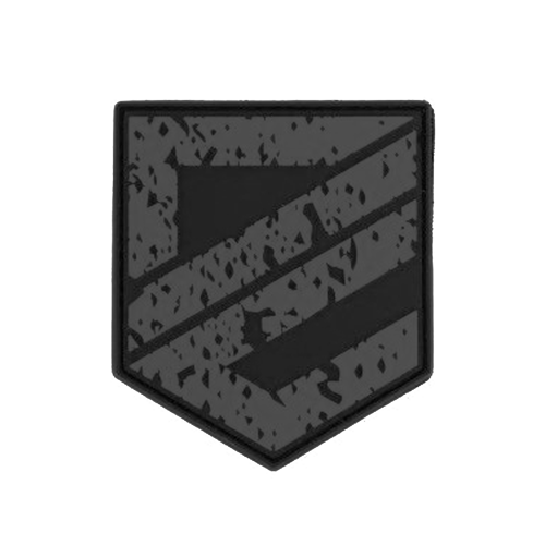 Schwarzes Abzeichen mit Schraffurmuster aus diagonalen Streifen und gesprenkelter Textur.