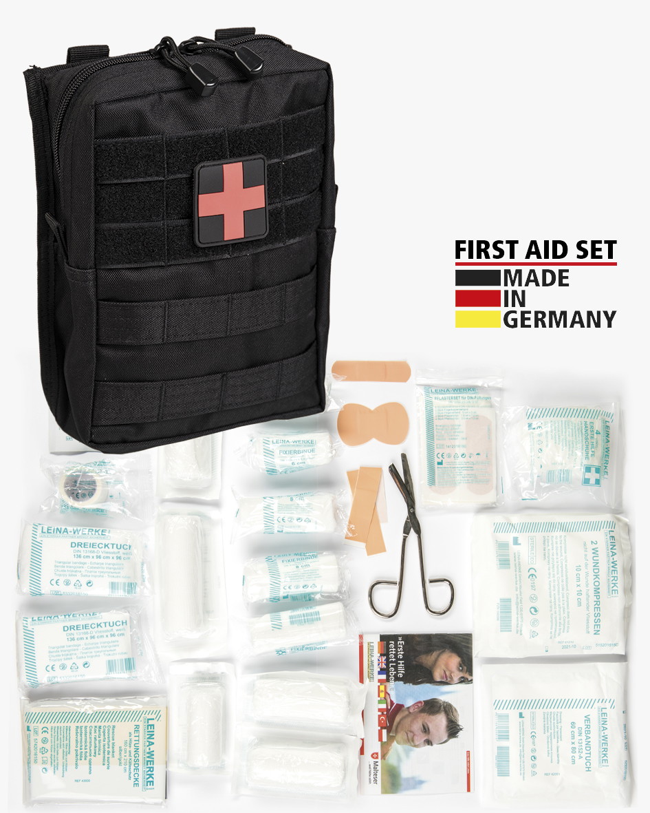 Erste-Hilfe-Set mit Tasche, Pflastern, Verbänden und Schere, Made in Germany-Label.