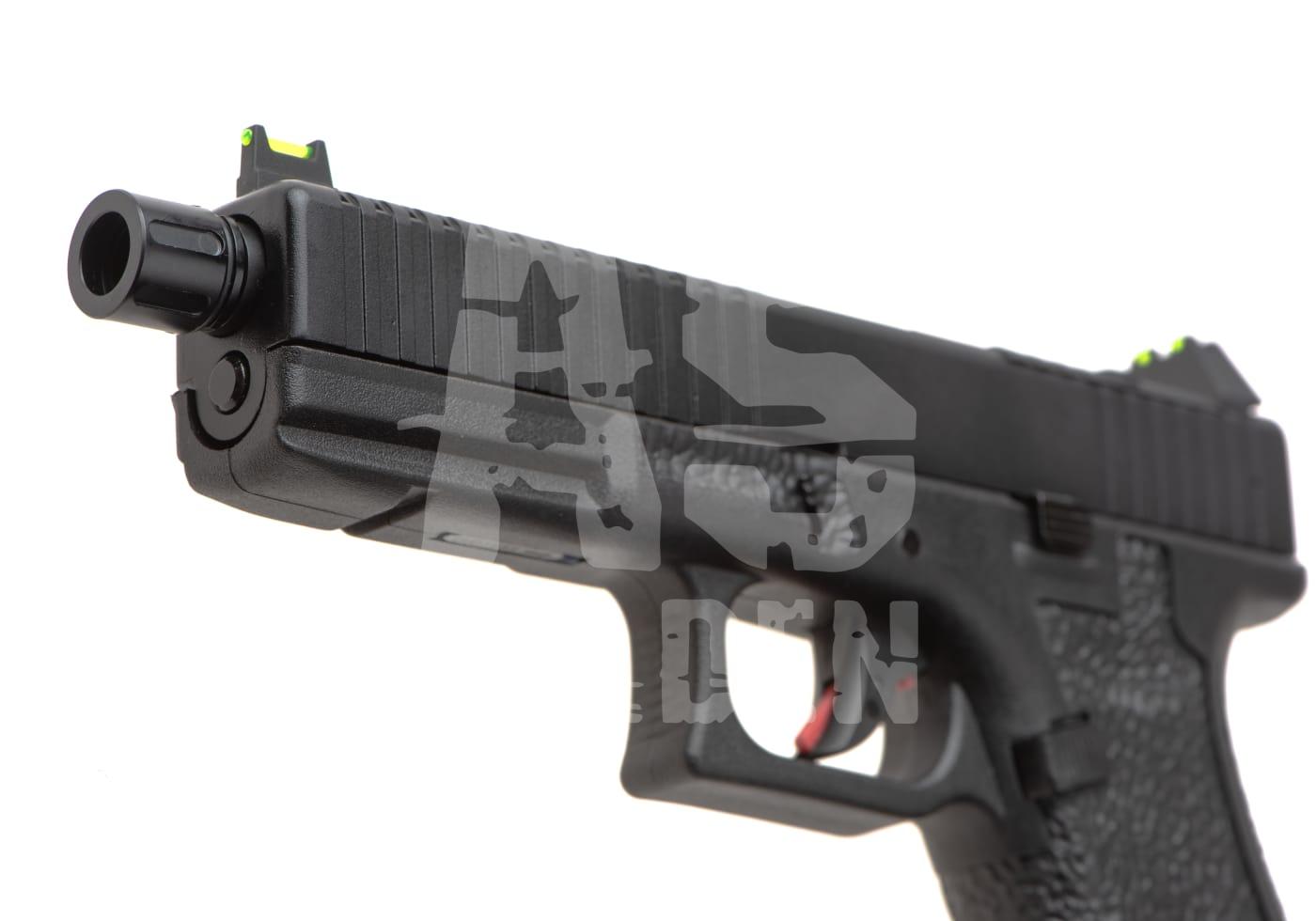 Schwarze Airsoft-Pistole mit grünem Visier, Seitenansicht.